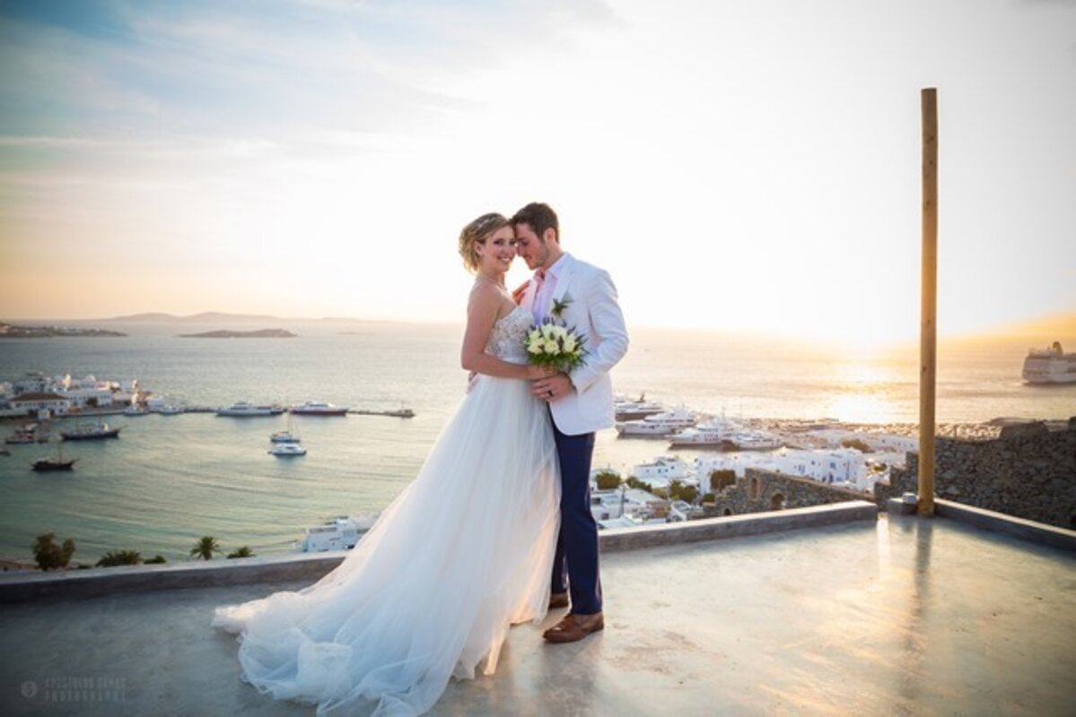 Romantic Mykonos Wedding at Sunset – Bride and Groom Overlooking the Aegean Sea | Destination Wedding in Greece